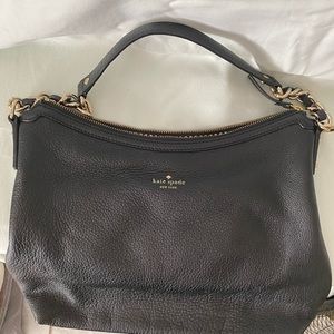 Kate Spade hand bag. It can be used as a shoulder bag.